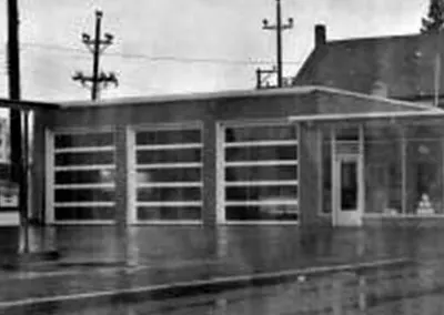 The original station and service bays, in black and white
