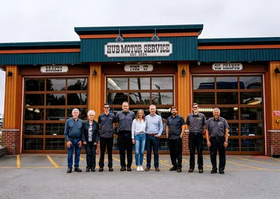 The team in front of the shop