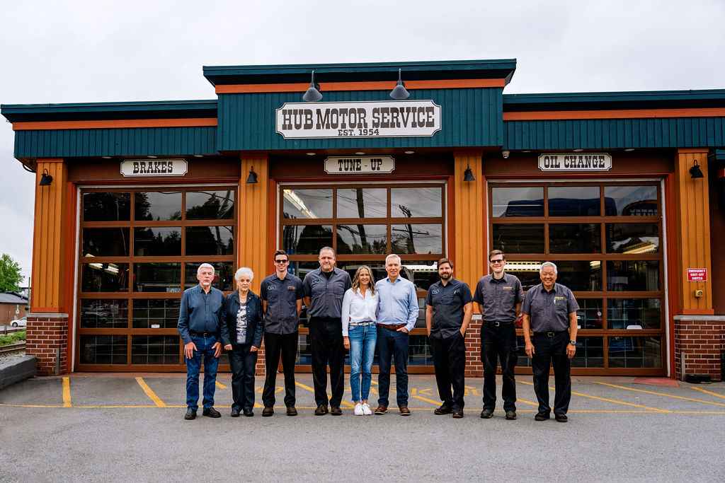 The Hub Motor Service team in front of the shop