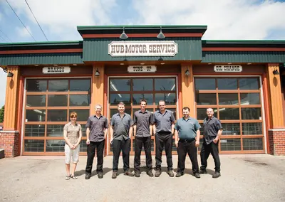 The team outside the service bays