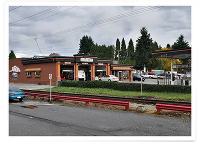 The shop seen from across the railway tracks